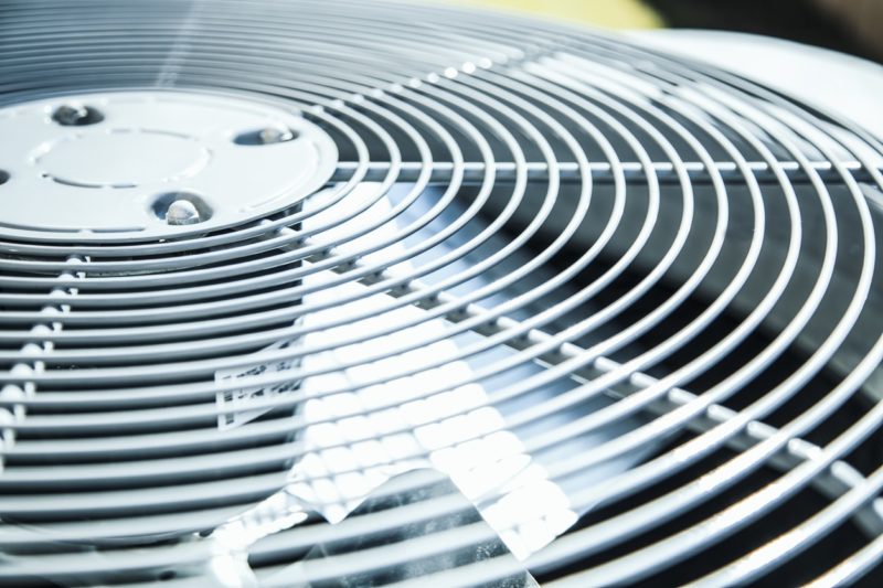 a close-up of the top of an outdoor AC system